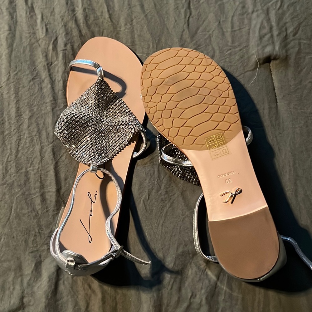 Women’s size 8.5 sandal, silver straps. Original box and shoe bag